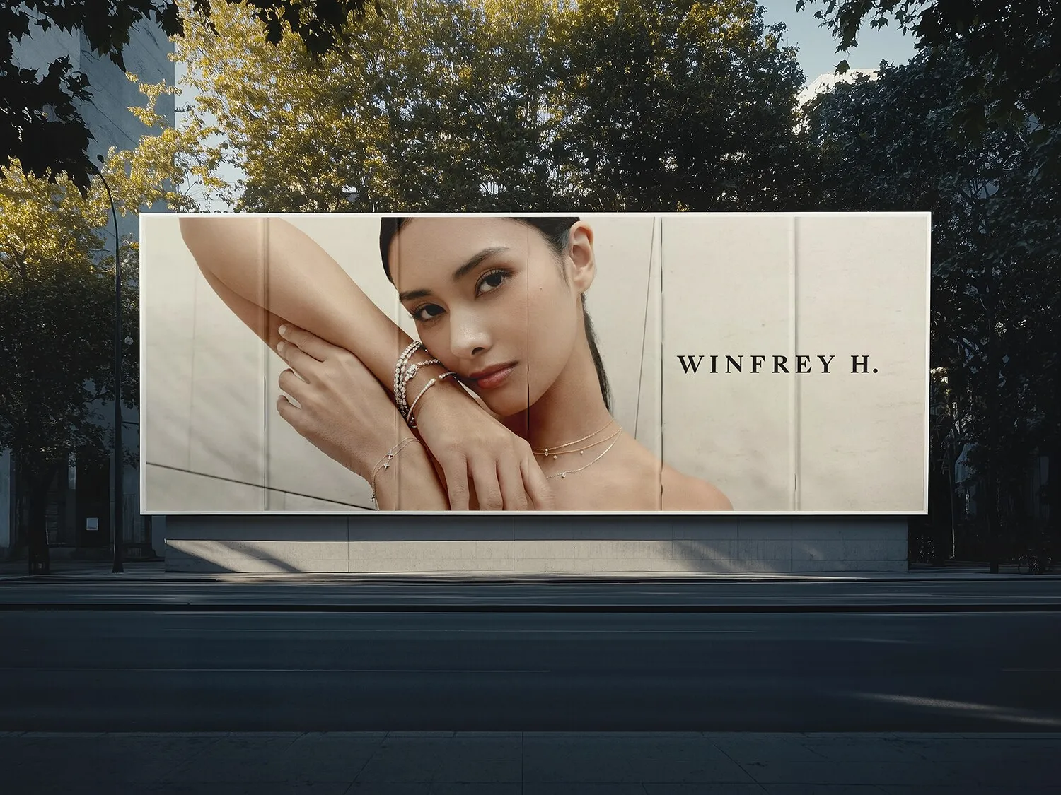 A roadside billboard carrying a campaign frame and the Winfrey H. wordmark