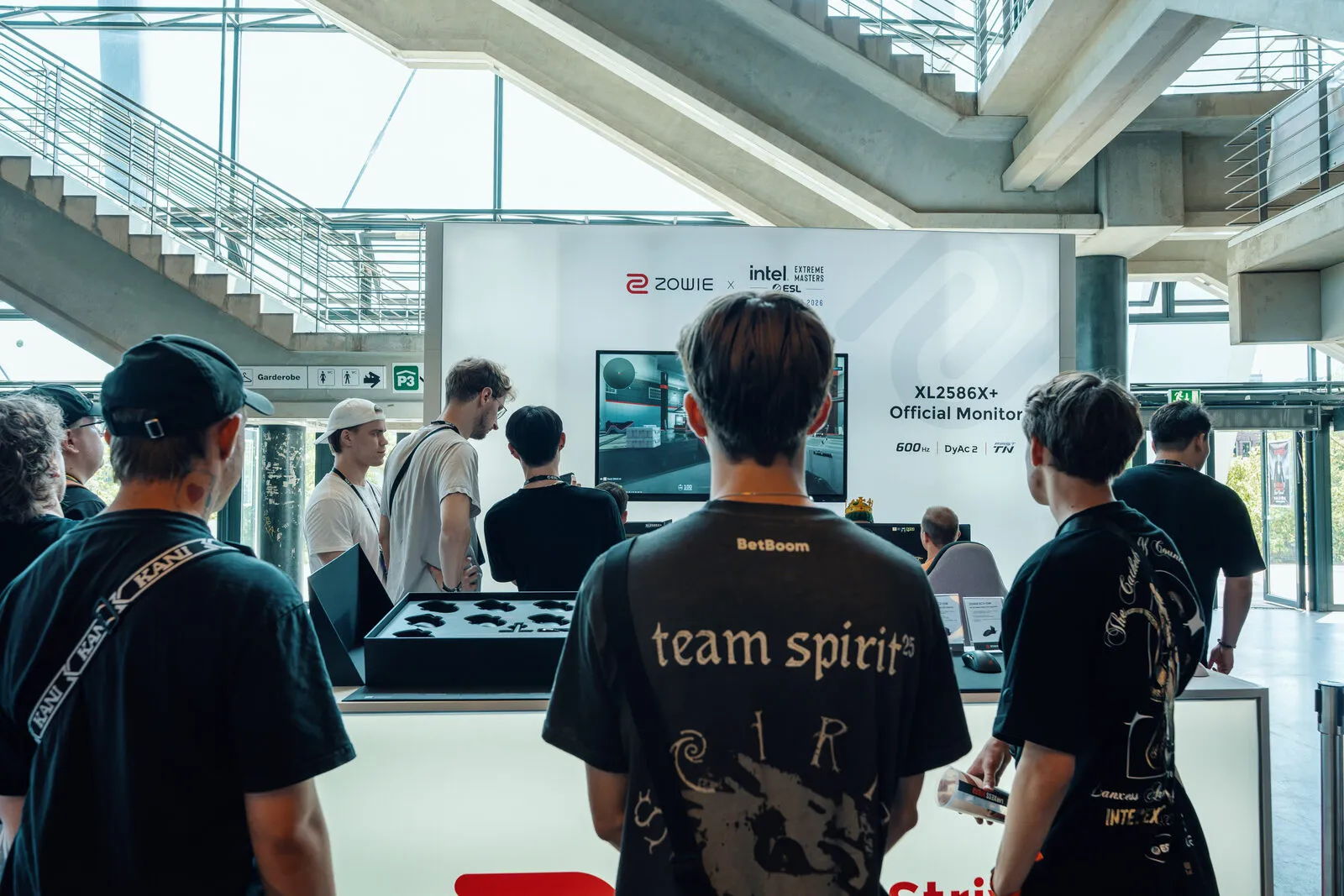 Visitors at the stand under the ZOWIE and Intel Extreme Masters wall, the XL2586X+ named as official monitor
