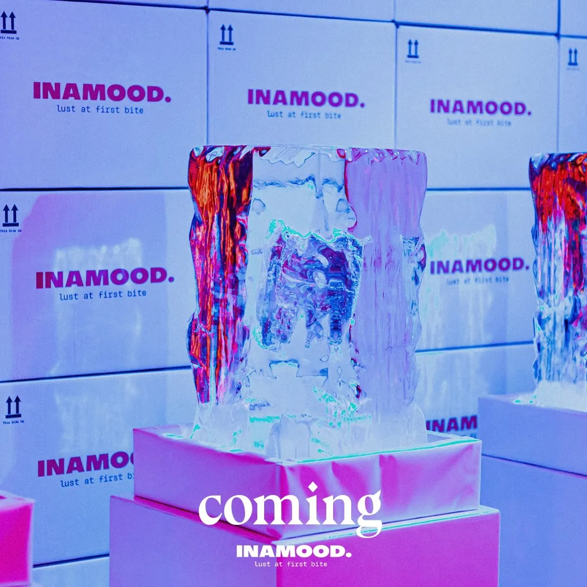 Teaser post: ice blocks lit in pink and blue, captioned 'coming'