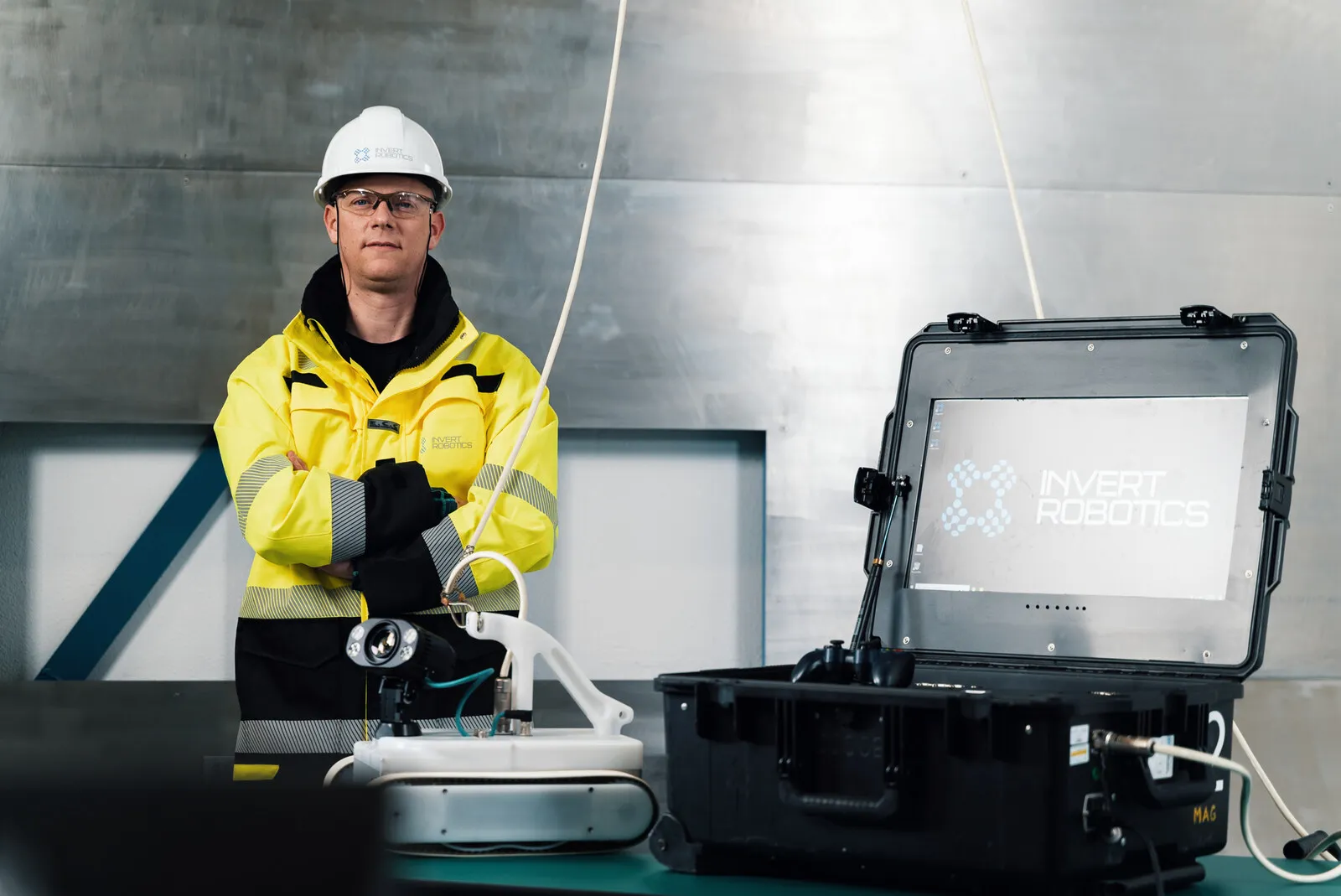 An operator in hi-vis working from the open control case