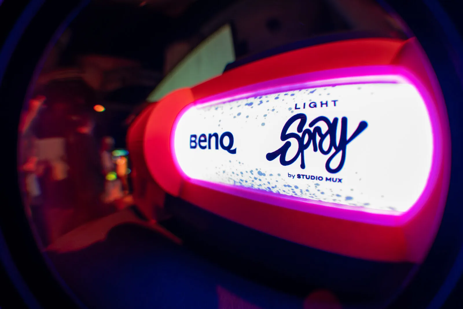 The BenQ Light Spray can by Studio MUX, lit pink in the dark hall
