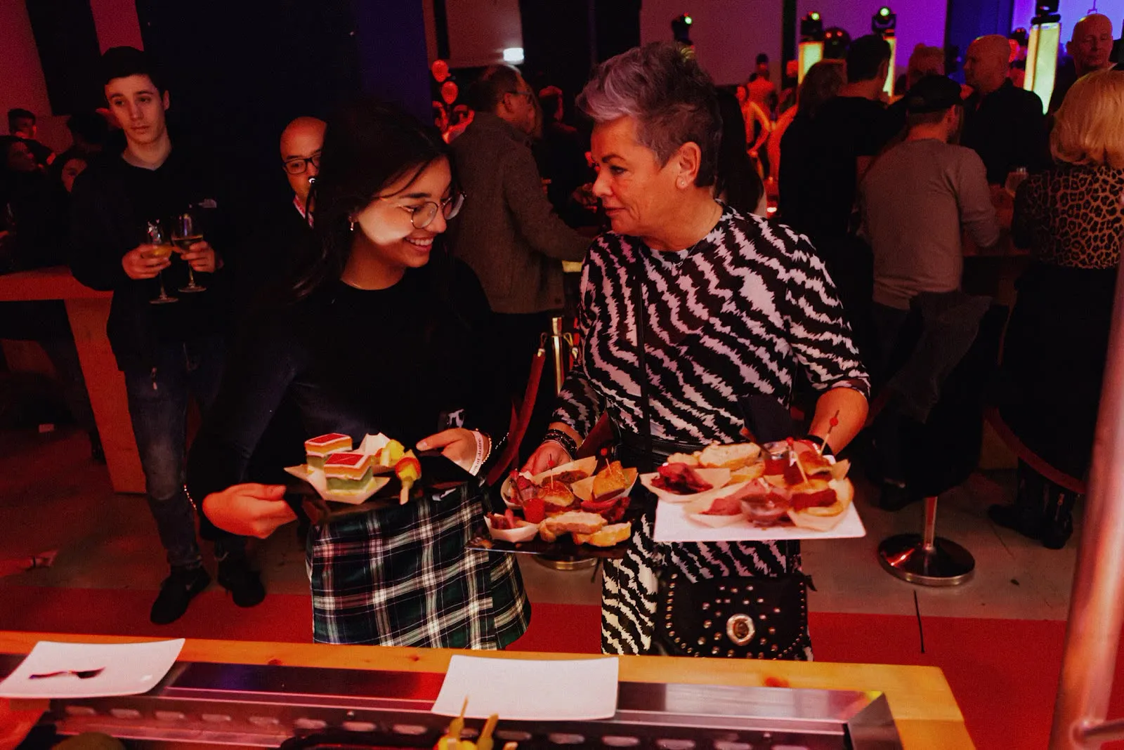 Guests collecting tasting plates at the launch event