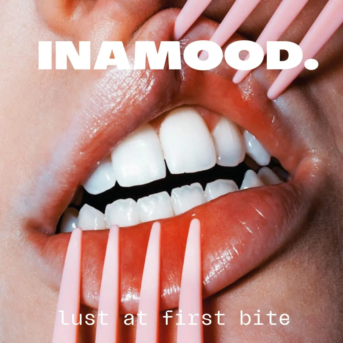 Campaign image: an open mouth with pink nails at the lips